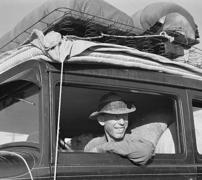 Farmer from Independence, Kansas, on U.S. 99 near Fresno at cotton chopping time. He and his family have been in California for six months  Photo: Dorothea Lange