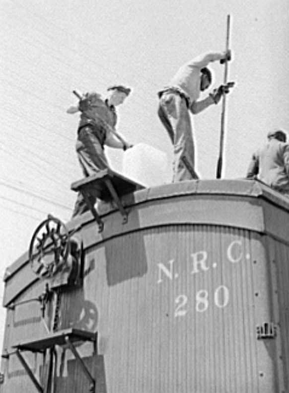 Icing refrigerator cars for strawberries, Hammond, Louisiana Photo: Russell Lee