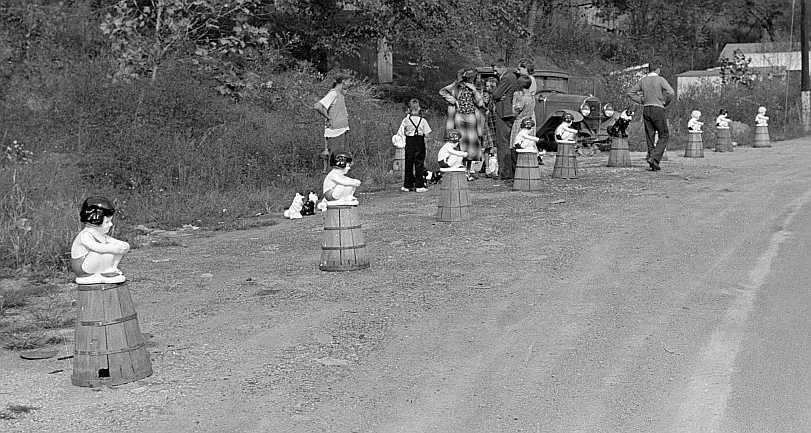 Kewpie dolls bathing girls for sale along main highway near Charleston, West Virginia 1938 Photo: Marion Post Wolcott