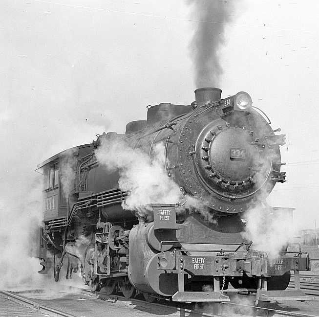 Locomotive in railroad yards along river, St. Louis, Missouri  Photo: Arthur Rothstein