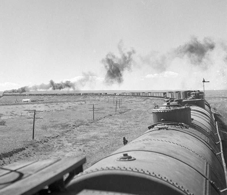 Train about to cross Pecos River along the Atchison, Topeka, and Santa Fe Railroad between Clovis and Vaughn, New Mexico Photo: Jack Delano