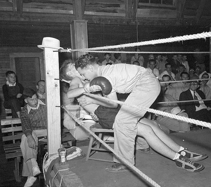 Second tending to boxer in corner of ring, Rayne, Louisiana  Photo: Russell Lee